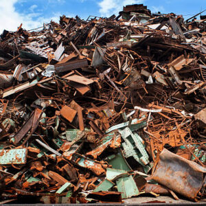 Tall pile of rusted metal junk to be recycled, near harbor, Portsmouth, New Hampshire.